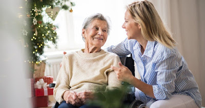 woman sharing a laugh with her elderly loved one