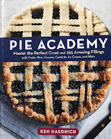 cover of hardcover book: Pie Academy by Ken Haedrich with a lattice topped blueberry pie