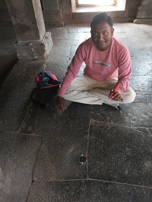 Guide Amol.Sardar demonstrates compaas magnetic effect in Ramgaya temple.