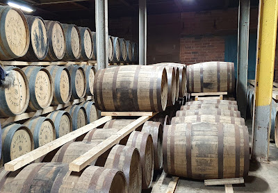 White Peak distillery whisky barrels in storage