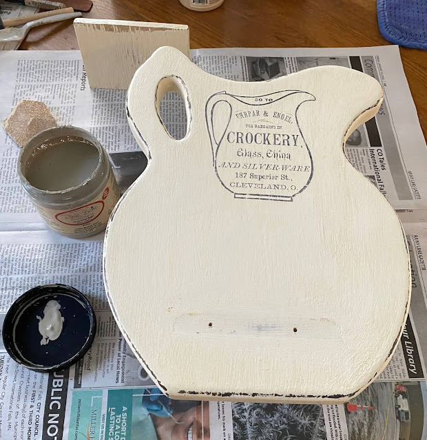Photo of a pitcher plaque readied for repainting.