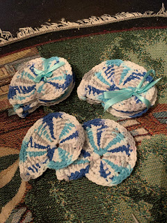 2 sets of 4 cloths each tied with aqua ribbon and 2 separate cloths.
