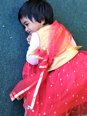 A happy little girl enjoying during the Hindu festive days