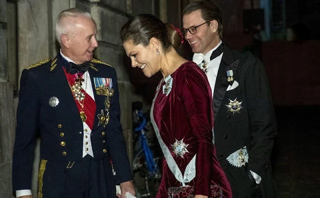 Royal Swedish Academy of War Sciences. Crown Princess Victoria wore a burgundy wine-red velvet gown, dress