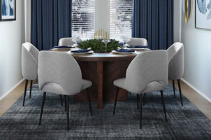 Dining room table and chairs on blue rug