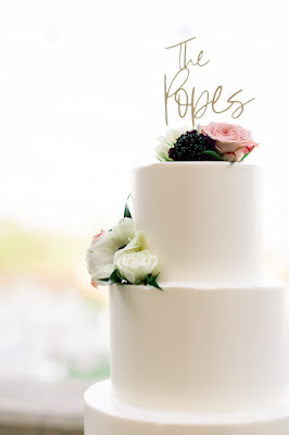 Wedding cake with flowers and topper