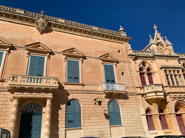 Limestone building, with balcony and baroque features
