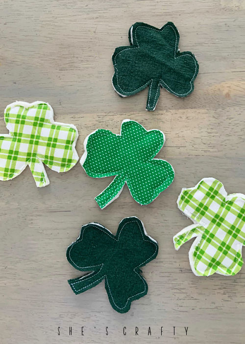 Fabric Shamrocks sewn around the edges with sewing machine.