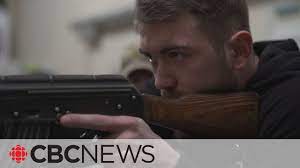 Ordinary Ukrainians learn to use rifles to join the fight against Russia