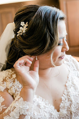 bride fixing earring