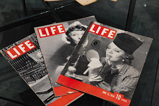photograph of covers of 3 LIFE magazine issues