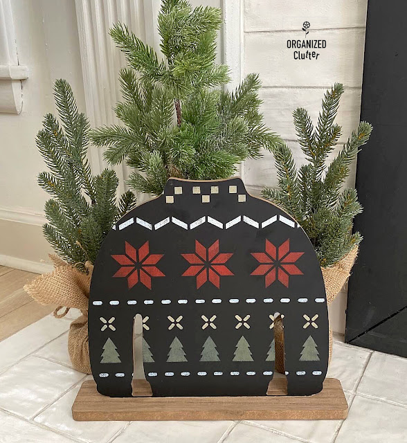 Photo of a Target Bullseye Playground Christmas Sweater Chalkboard stenciled with a Poinsettia Sweater stencil from Old Sign Stencils.