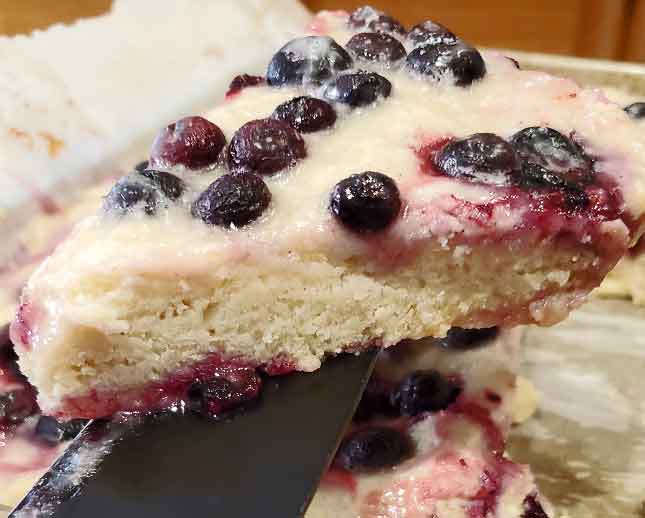 a slice of sheet pan blueberry scones