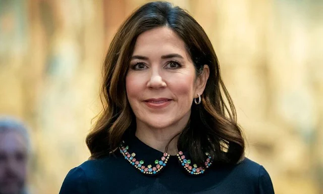 Crown Princess Mary wore a new crystal-embroidered pleated crepe midi dress by Red Valentino. Dulong Esme gold earrings