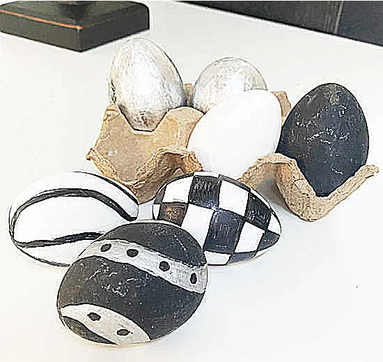 black and white eggs in carton