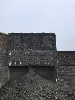 A picture of the remains of a building by the slag heap at New Glencrieff Mine.  The building had rubble in it that has poured down from a chute.  Photograph by Kevin Nosferatu for the Skulferatu Project.