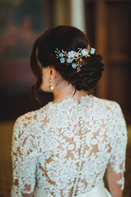 bride in lace dress with blue hairpiece