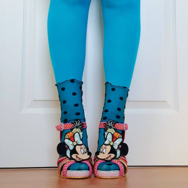 front facing legs wearing blue tights, polka dot tulle socks and Minnie Mouse Disney sandals