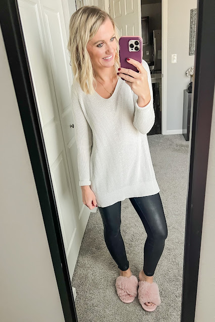 Faux leather leggings with a cozy sweater and slippers.
