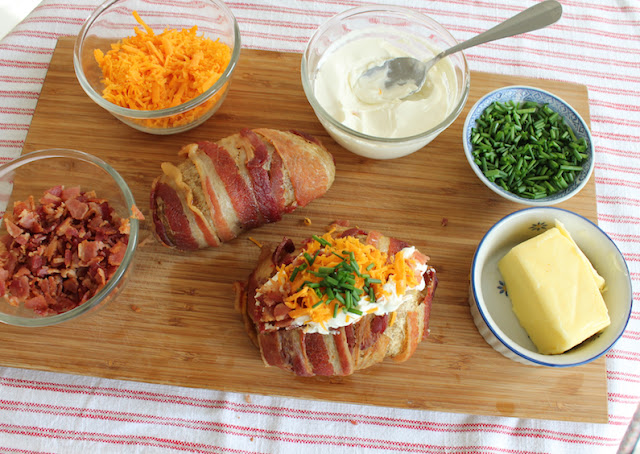 Food Lust People Love: Bacon-wrapped Loaded Baked Potatoes give bacon almost equal billing with the wonderful fluffy potato inside. Bacon-wrapped and bacon filled, they're a bacon lovers perfect baked potato. (Seriously good.)