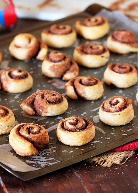 Baked Crescent Cinnamon Roll Bites on Baking Sheet Image