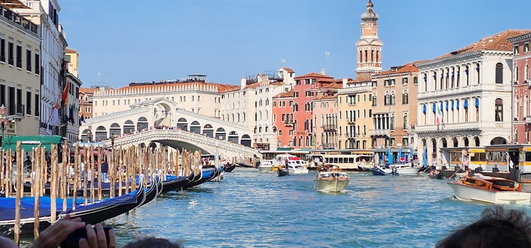 At Rialto Bridge: This is the oldest and most famous bridge in Venice, Italy