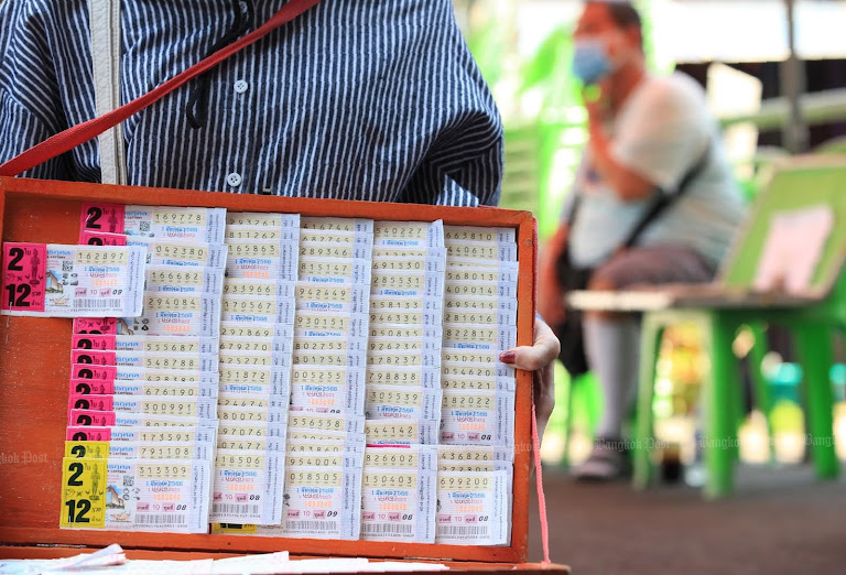 A vendor hawks lottery tickets, betting on hope in Thailand’s gamble.