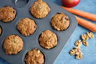 Morning glory muffins in a muffin tin.