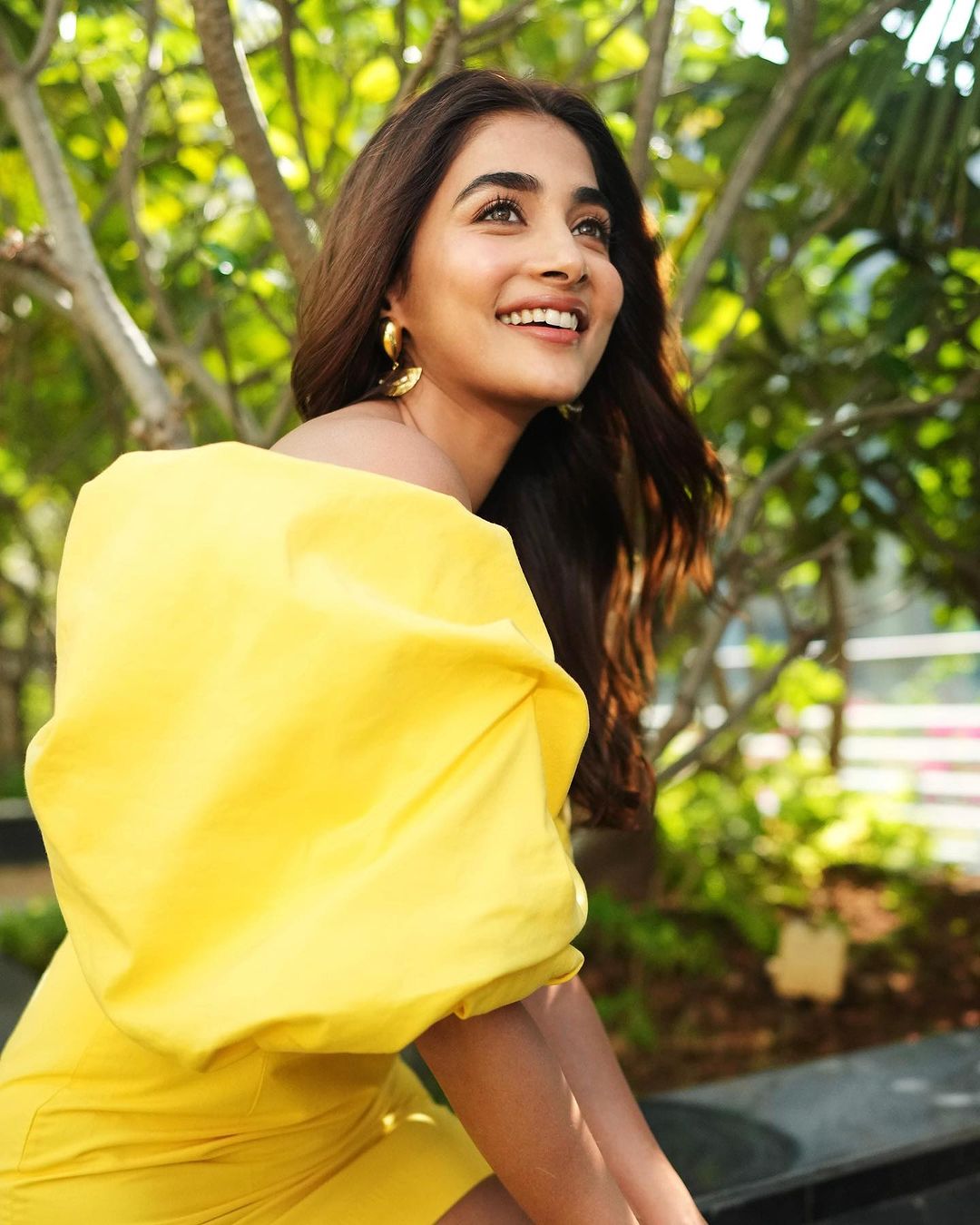 Dusky beauty Pooja Hegde Flaunts her perfect Cleavage and Toned legs in a Yellow Off-shoulder Mini-Dress