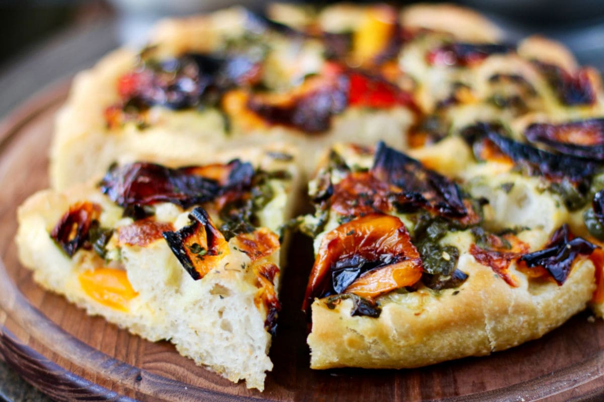 Roasted Pepper and Chile Focaccia sliced on a board.