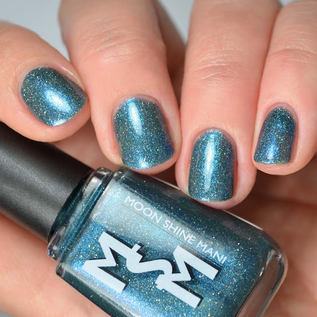 blackened teal jelly nail polish with glitter swatch