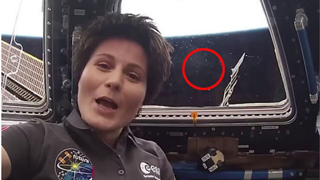 Italian Astronaut has UFOs pass behind her in footage.