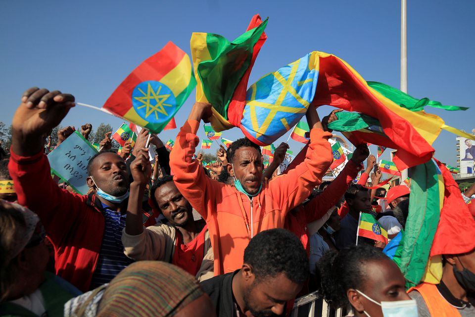 A man holds the Ethiopian national flag during a pro-government rally to denounce what the organisers say is the Tigray People’s Liberation Front (TPLF) and the Western countries' interference in internal affairs of the country, at Meskel Square in Addis Ababa, Ethiopia, November 7, 2021. REUTERS/Tiksa Negeri
