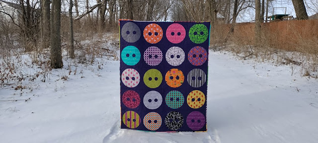 Button quilt with raw edge applique