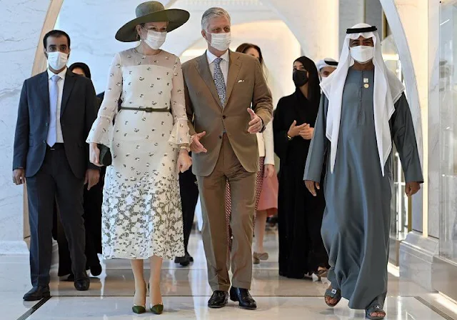 Queen Mathilde wore lace and tulle dress from Natan. King and Queen visited the pavilions of Belgium and United Arab Emirates