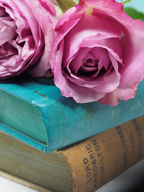 old books and roses