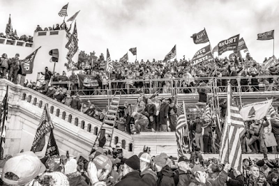 black and white photo of Trump rioters with signs and flags on the steps of the US Capitol, 3:19:18 PM, January 6, 2021, Washington, DC