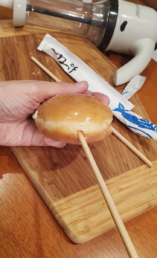 making a hole for the jelly in a jelly donut