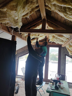 The men get started on the ceiling