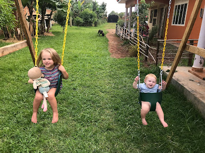 The girls swinging; Aubrey Anne holding her doll as well.