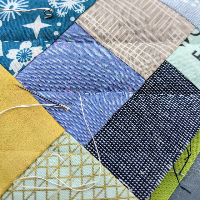 straight line hand quilting stitches and needle