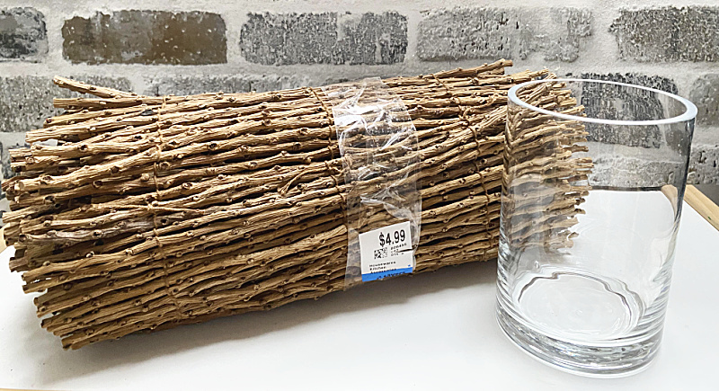 roll of sticks and a glass vase