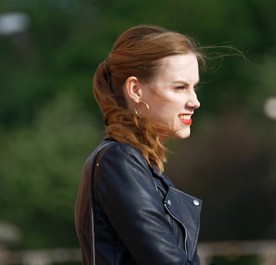 A Fashionable Woman Wearing Black Leather Jacket