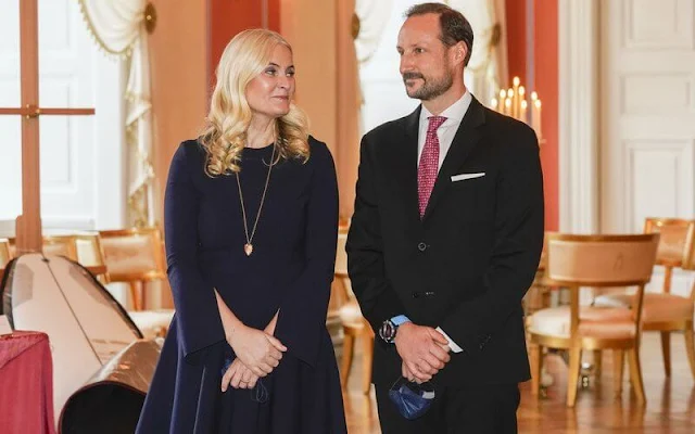 Crown Princess Mette-Marit wore a navy split sleeve stretch dress by Oscar De La Renta