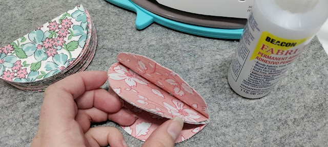 Gluing fabric circles to make an ornament