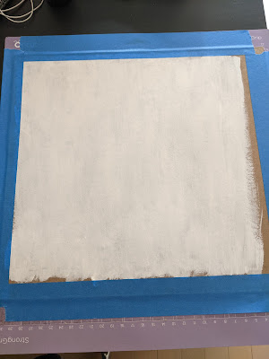 photo of chip board painted white and taped to Cricut mat