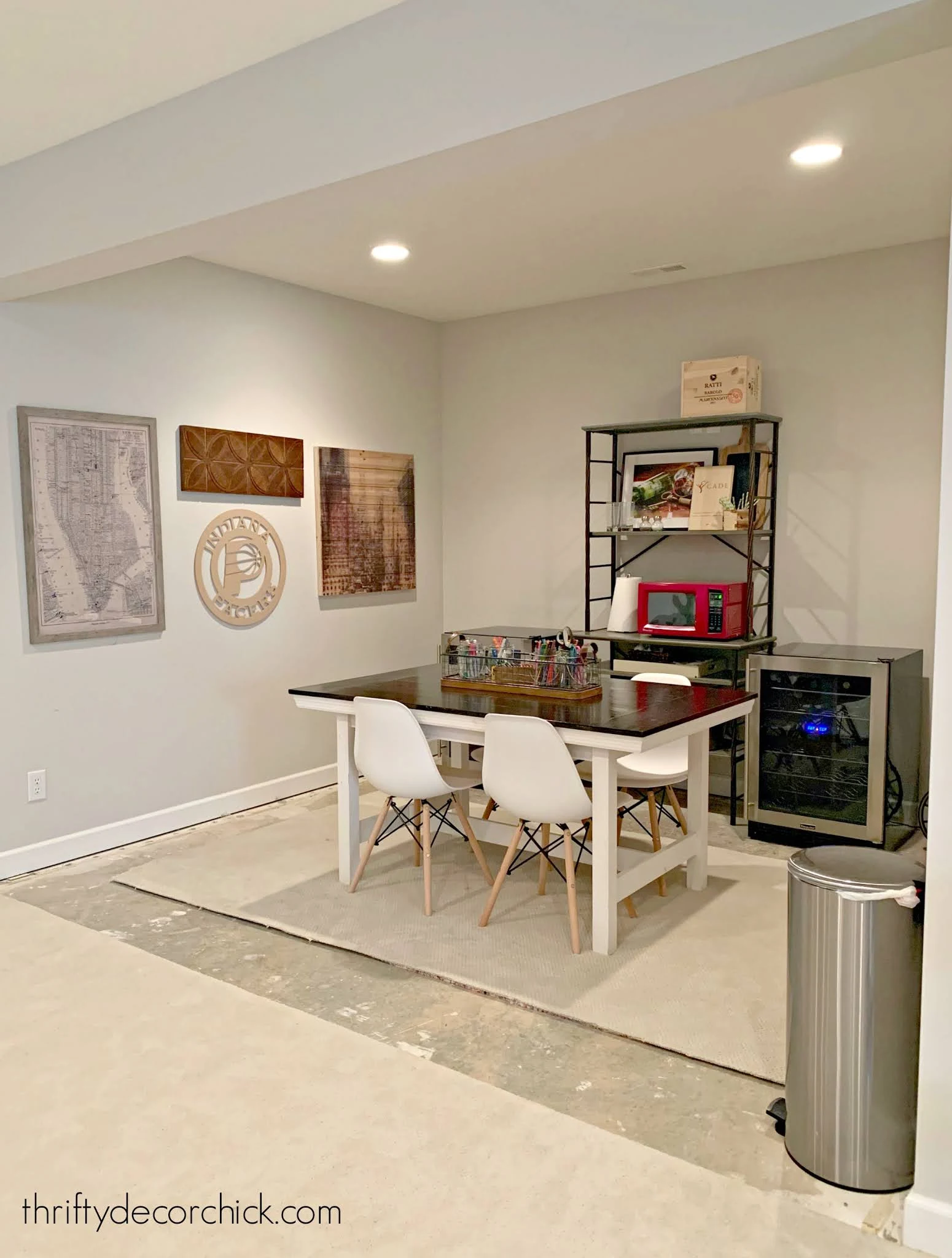 unfinished basement kitchenette with table