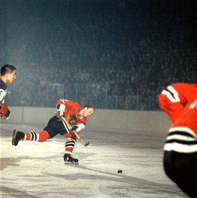 color photograph of hockey player Bobby Hull talking a slap-shot on the ice