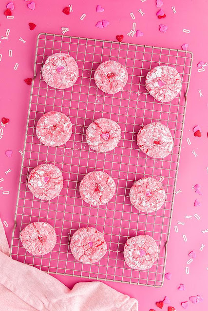 cookies on a wire cooling rack with pink background.