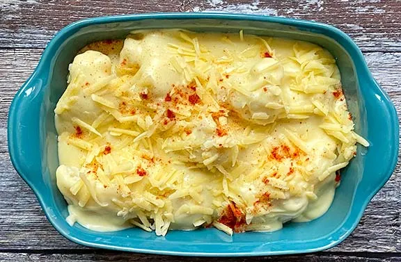 Homemade cauliflower cheese ready to bake